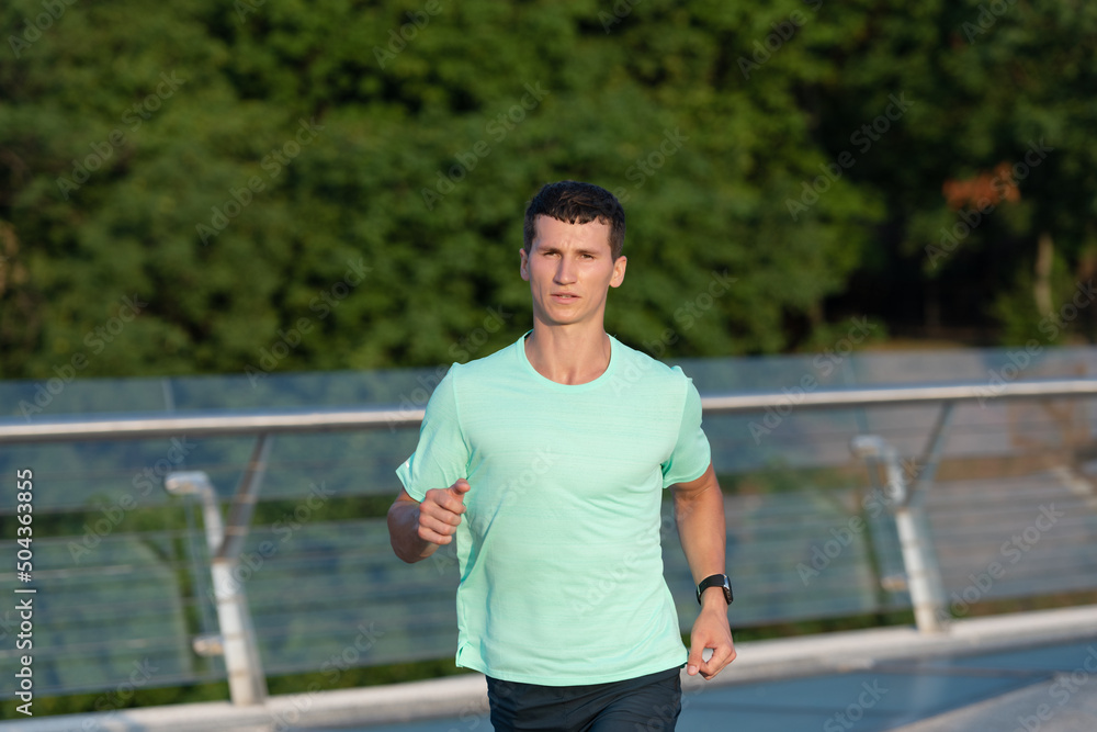 sporty man runner running in sportswear outdoor