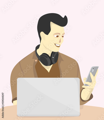 man working with laptop holding a phone