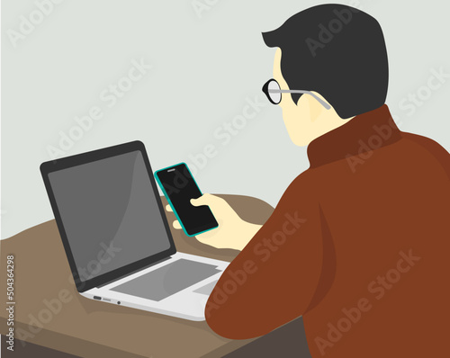 businessman working with laptop holding a phone