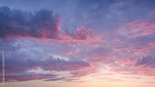 Pink sky with clouds at beautiful sunset as natural background.