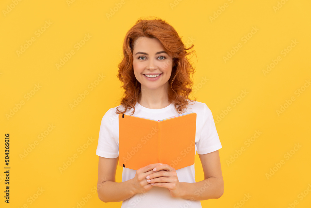 cheerful woman hold book on yellow background, school cheerful woman hold book on yellow background, school