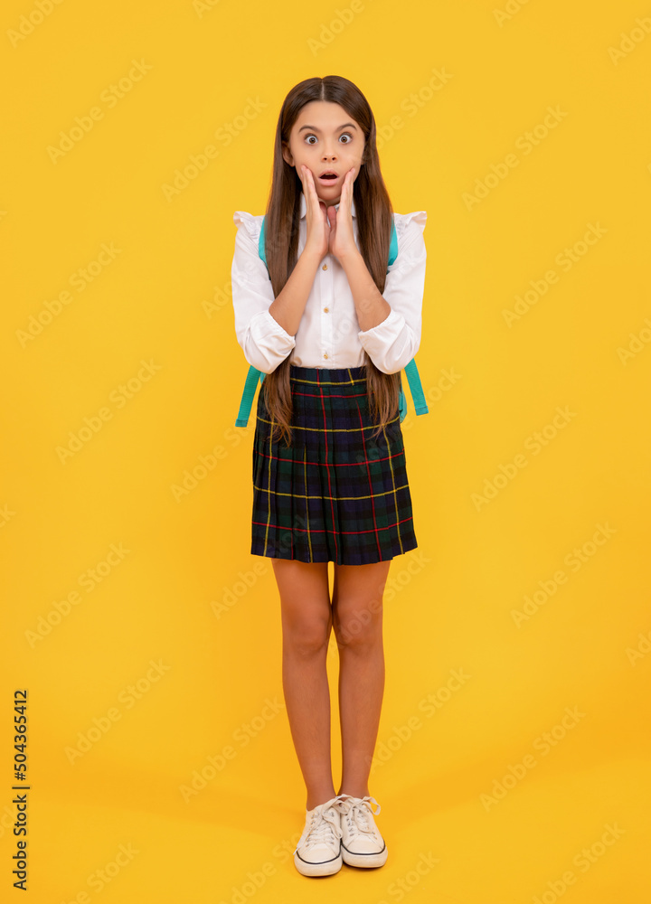 kid in uniform on yellow background. september 1. childhood. kid in uniform on yellow background. september 1. childhood.