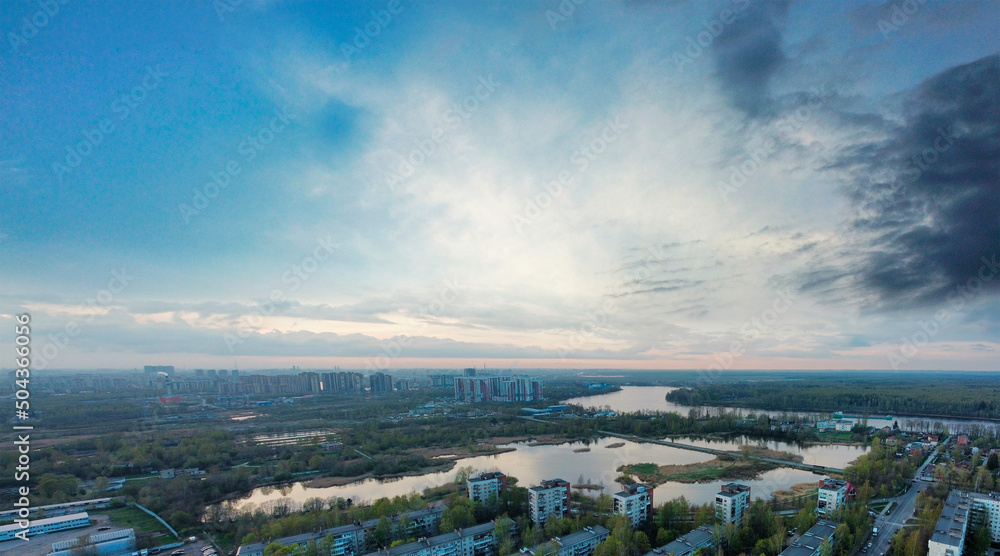 aerial view of suburb of Sanit-Petersburg at sunset. panorama of the city with beautiful lakes and Neva river on the background.