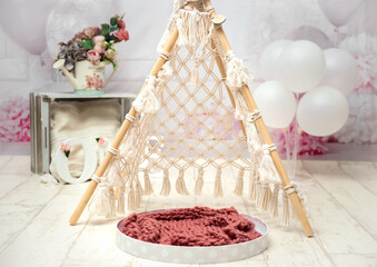 pink and white decoration for a 1st birthday cake smash studio photo shoot with balloons, paper decor, cake and topper. High quality photo