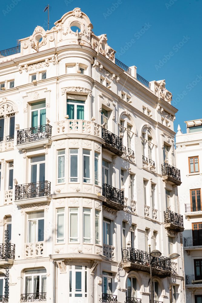 white building with stucco decor in valencia, spain.