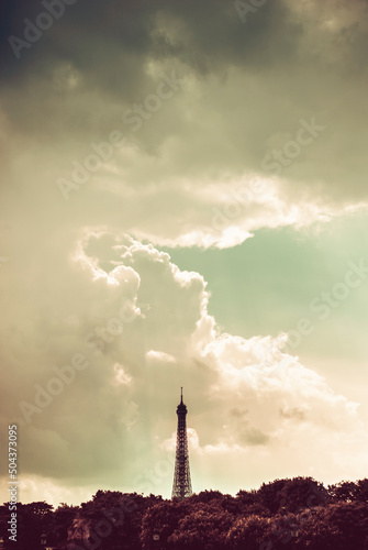 Cloudy skies above Eiffel Tower in Paris