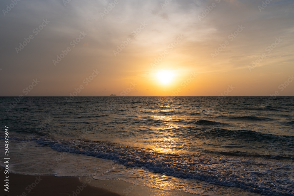 beautiful afterglow sky with waves on sea water