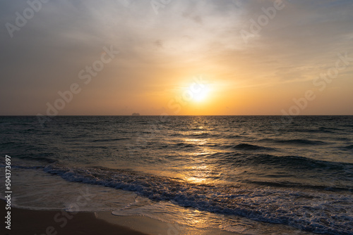 beautiful afterglow sky with waves on sea water © be free