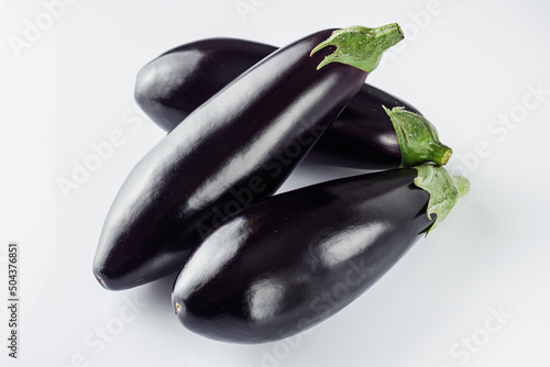 fresh natural eggplant on a white acrylic background