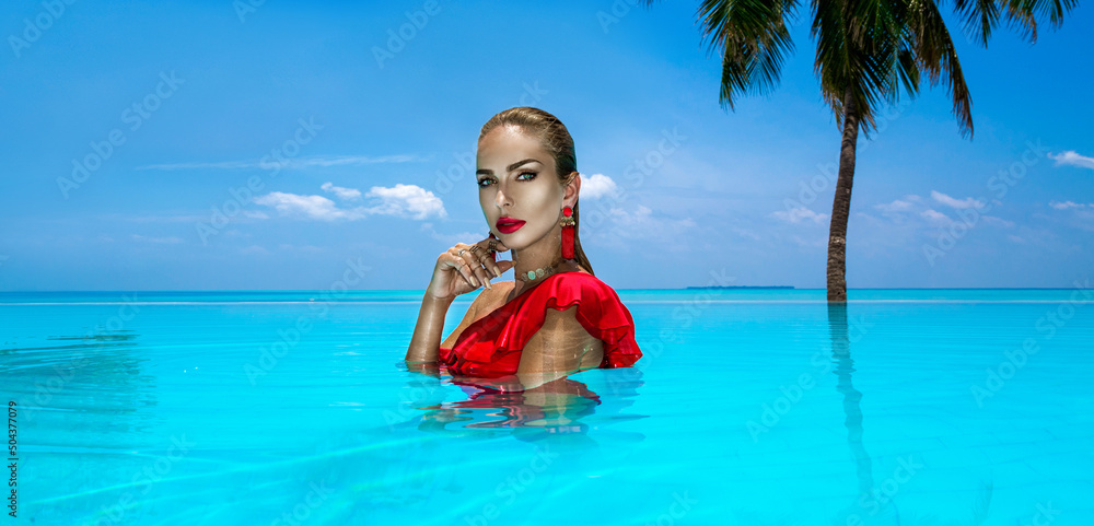 Elegant tanned woman in red swimsuit in pool on tropical Maldives island. Beautiful bikini girl in pool with view on horizon. Sexy model near the pool on beautiful Indian ocean landscape. Travel. Elegant tanned woman in red swimsuit in pool on tropical Maldives island. Beautiful bikini girl in pool with view on horizon. Sexy model near the pool on beautiful Indian ocean landscape. Travel.