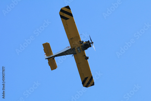 A forest and meadow fire extinguished from the air by a fire-fighting plane photo