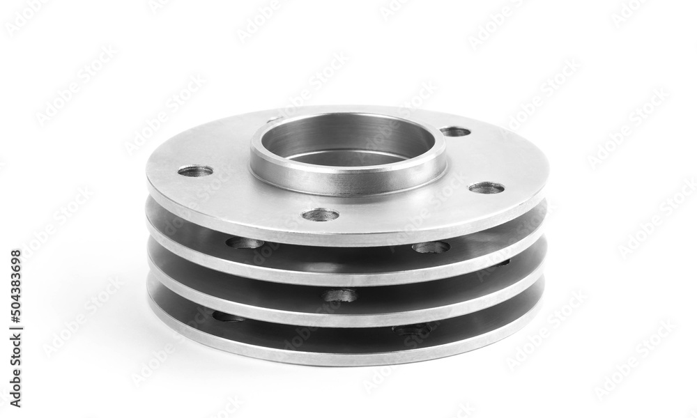 Aluminum wheel spacers. Four through spacers. Isolated on a white background Aluminum wheel spacers. Four through spacers. Isolated on a white background