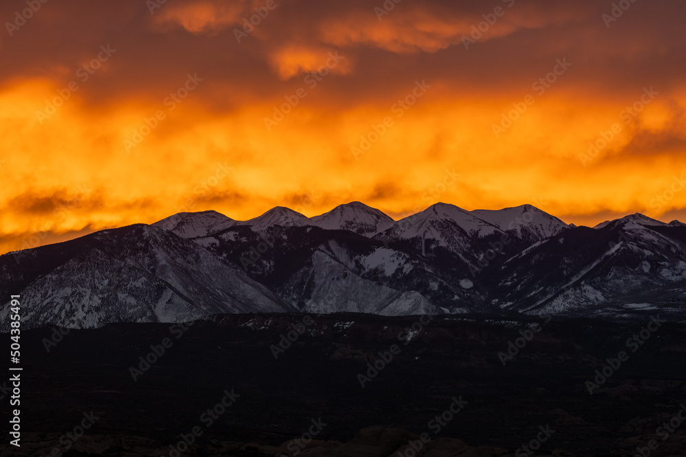 Bright Orange Clouds Backlight The La Sal Mountains AT Sunrise