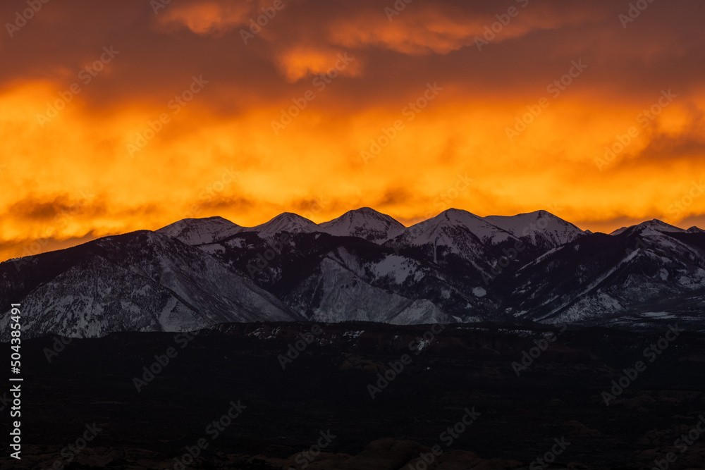 Bright Orange Clouds Backlight The La Sal Mountains AT Sunrise Bright Orange Clouds Backlight The La Sal Mountains AT Sunrise