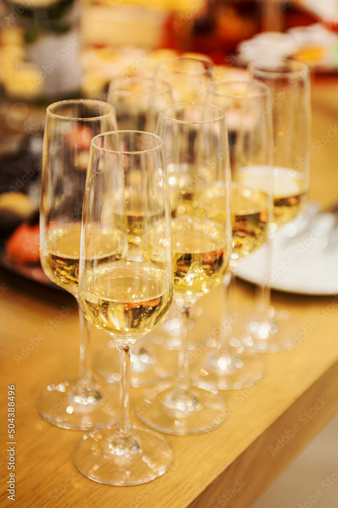 Few glasses of champagne on the banquet table Few glasses of champagne on the banquet table