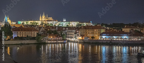 Night view of Prague Castle complex, largest in the world, Czech national symbol for more than thousand years, from Charles Bridge (Karluv Most), Prague, Czech Republic 