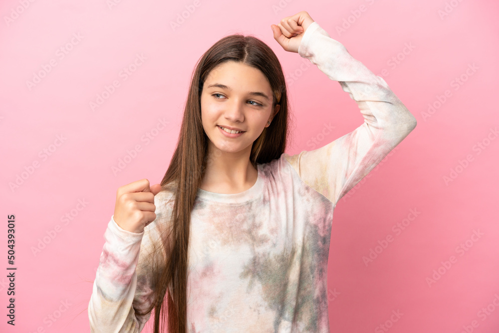 Little girl over isolated pink background celebrating a victory Little girl over isolated pink background celebrating a victory