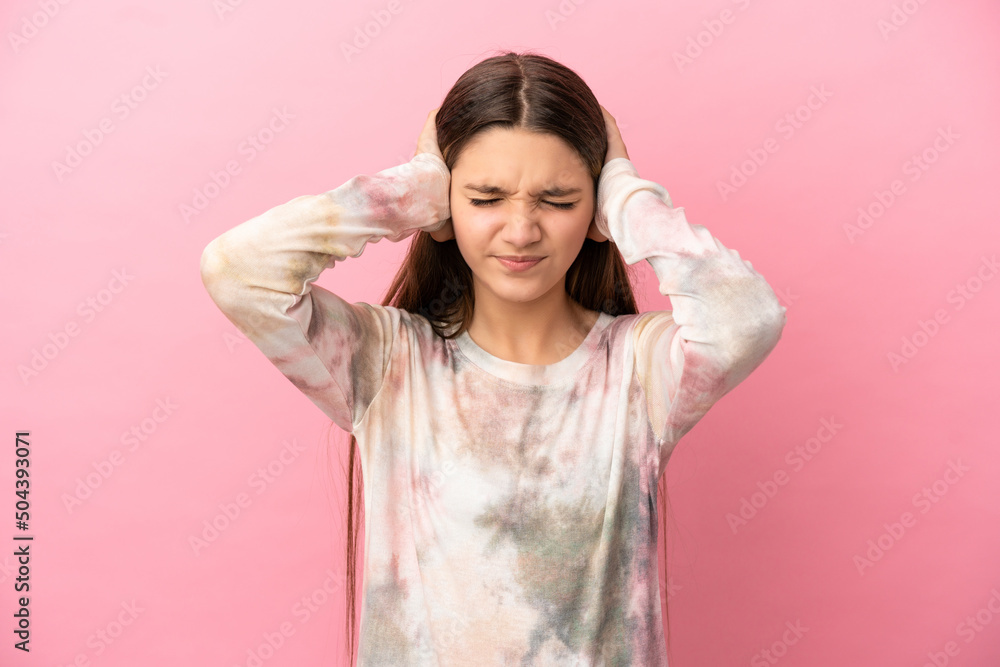 Little girl over isolated pink background frustrated and covering ears Little girl over isolated pink background frustrated and covering ears