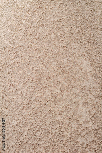 Sand textured by rain