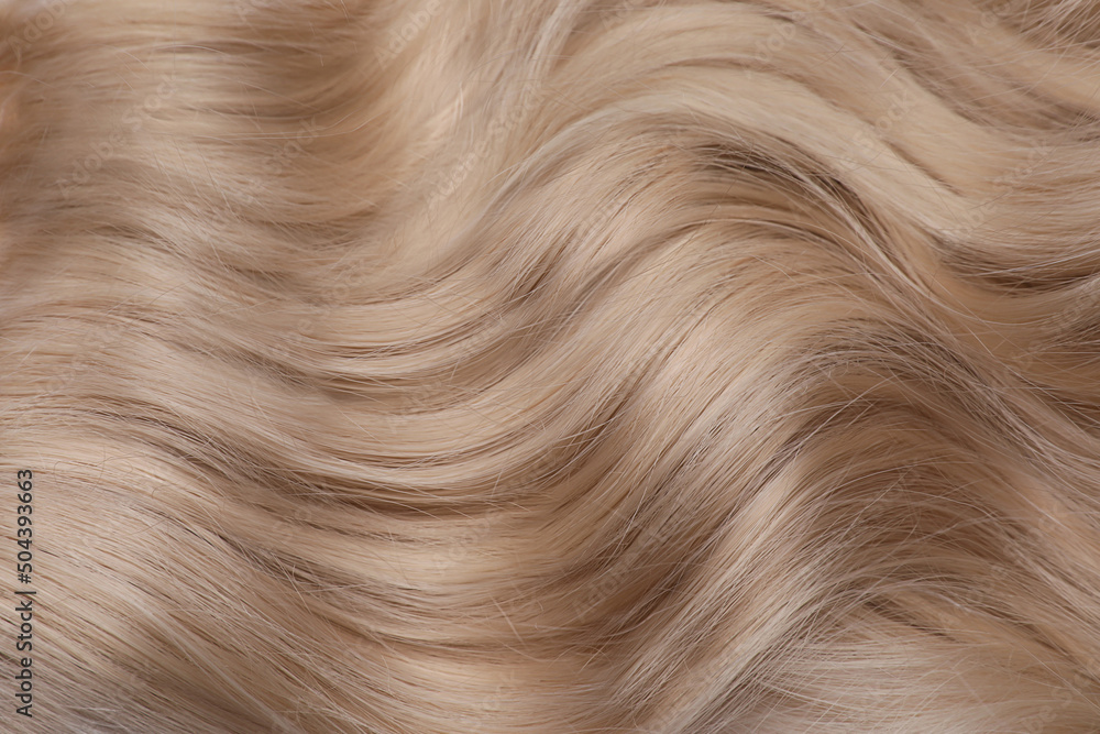 Obraz premium Beautiful blonde hair as background, top view