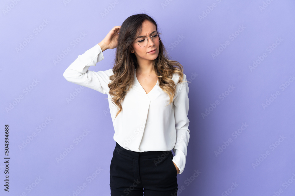 Young caucasian woman isolated on purple background having doubts while scratching head Young caucasian woman isolated on purple background having doubts while scratching head