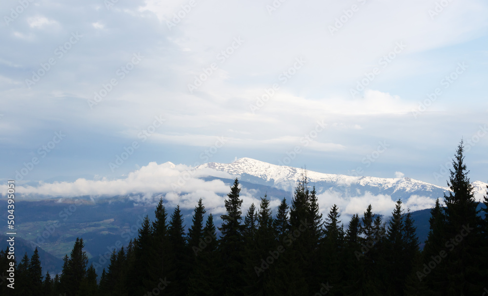 Fog under a high mountain. Concept silhouette landscape photo. Horizontal orientation.