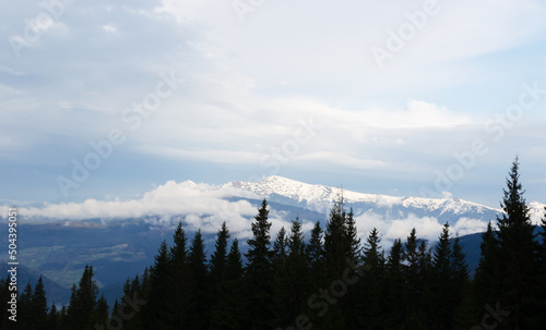 Fog under a high mountain. Concept silhouette landscape photo. Horizontal orientation.