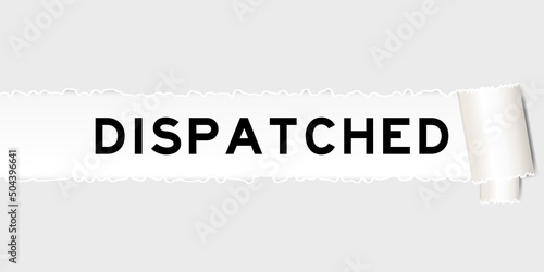 Ripped gray paper background that have word dispatched under torn part