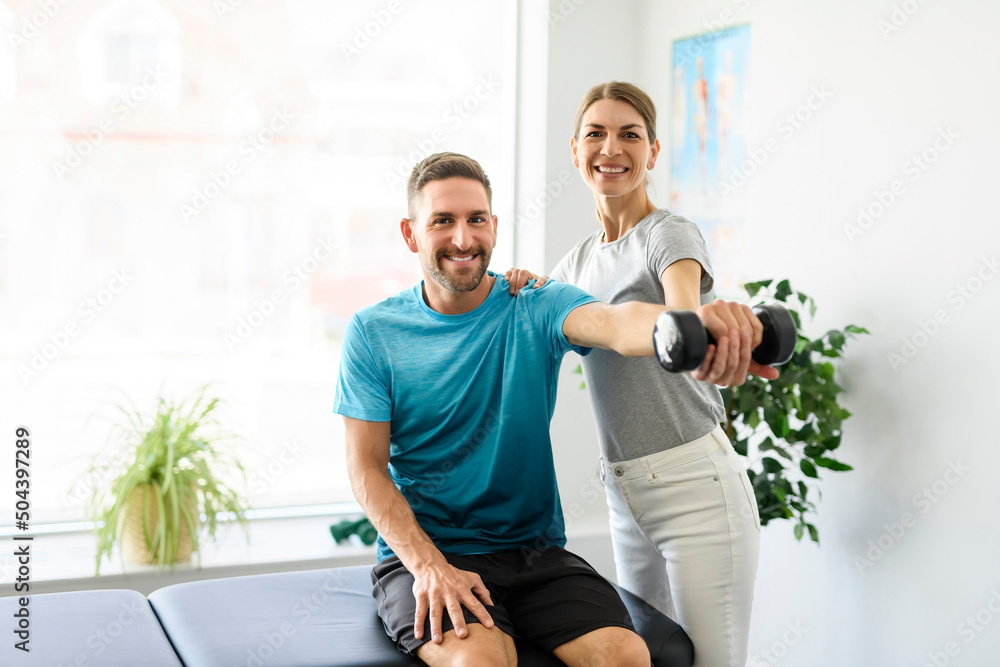 Modern rehabilitation physiotherapy woman worker with man client Modern rehabilitation physiotherapy woman worker with man client
