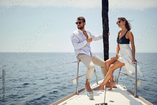 Classy rich couple sailing together; Luxurious lifestyle concept
