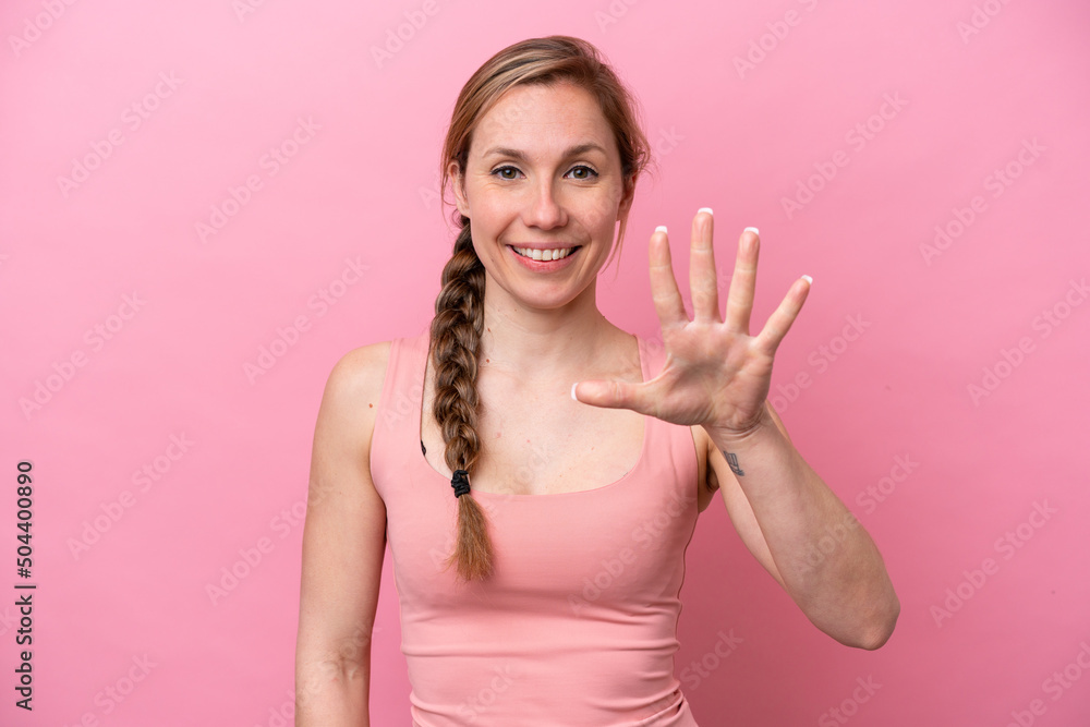 Young caucasian woman isolated on pink background counting five with fingers Young caucasian woman isolated on pink background counting five with fingers