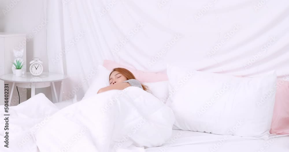 Calm young woman sleeping well in comfortable cozy fresh bed on soft pillow white linen orthopedic mattress, peaceful serene girl resting lying asleep enjoying healthy good sleep nap in the morning Calm young woman sleeping well in comfortable cozy fresh bed on soft pillow white linen orthopedic mattress, peaceful serene girl resting lying asleep enjoying healthy good sleep nap in the morning