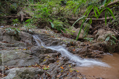 water flow on Tat Moel Waterfall at khuntan mountain national park.the Khun Than mountain range of the DoiKhun national park natural boundary between the northern Lamphun Lampang. photo