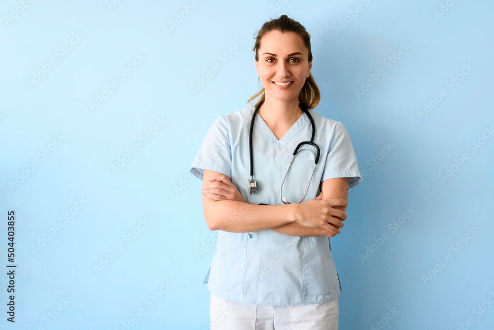 Smiling young inhalotherapy woman with stethoscope holding asthma pump - obrazy, fototapety, plakaty 