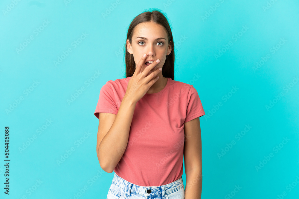 Young woman over isolated blue background surprised and shocked while looking right Young woman over isolated blue background surprised and shocked while looking right