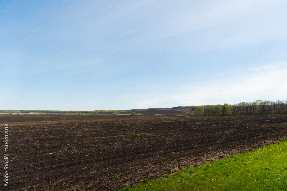 Agricultural grounds. Extensive fields plowed for grain crops.