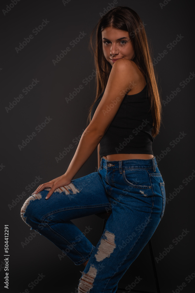 Posing while sitting on the chair Posing while sitting on the chair