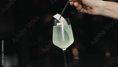 Experienced barman making alcoholic beverages in the modern bar