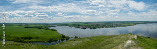 Sunny view on panorama of the Volga river. landscape with green hills, a clear summer sky and a river