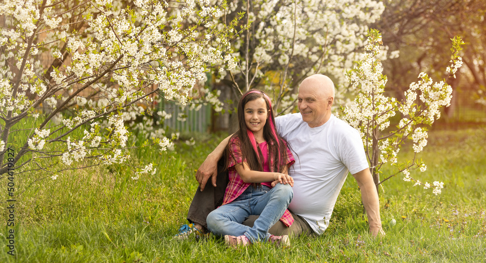 Adorable cute girl and grandfather walk in park. Adorable cute girl and grandfather walk in park.