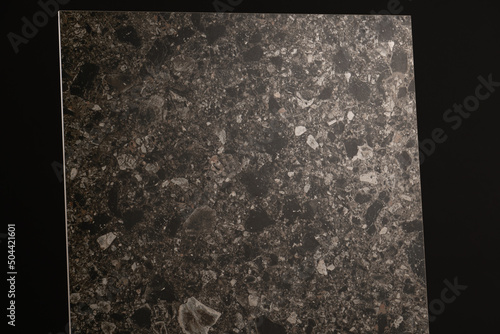 Porcelain tiles with a stone texture on a dark gray background