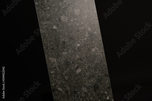 Porcelain tiles with a stone texture on a dark gray background