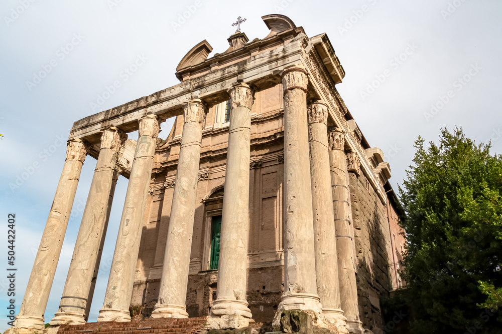 Panoramic close up view of the Antoninus and Faustina Temple in the Roman Forum (Foro Romano) in the city of Rome, Lazio, Italy, EU Europe. Ancient ruins of the Roman Temple on Via Sacra. Culture trip