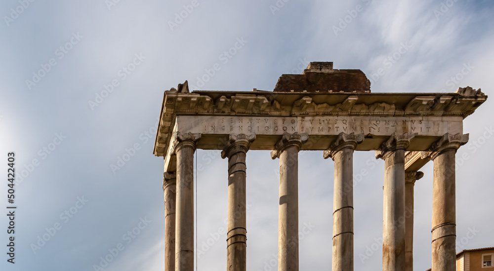 The columns of the Temple of Saturn and overview of the ancient ruins of the Roman Forum, UNESCO World Heritage Site, Rome, Lazio, Italy, Europe. Central Square area of the Roman Forum. Cityscape