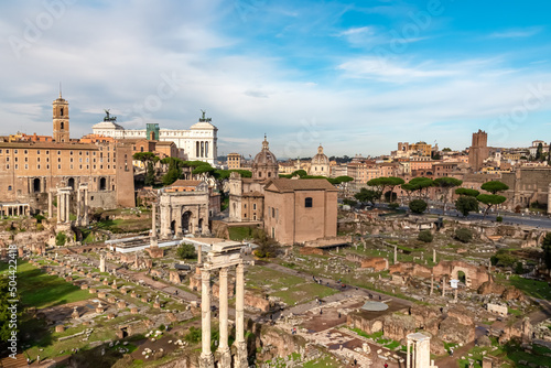 Panoramic view on ancient ruins of Roman Forum and Rome Skyline from Palatine Hill in city of Rome, Lazio, Italy, Europe, EU. Looking on Antoninus and Faustina Temple, Victor Emmanuel II monument