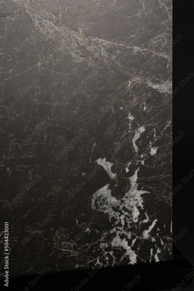 Porcelain tiles with a stone texture on a dark gray background