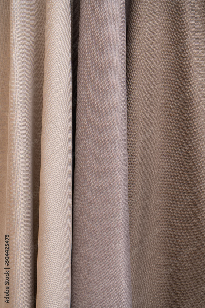 Fototapeta premium Folded fabric for curtains. Beige curtains.