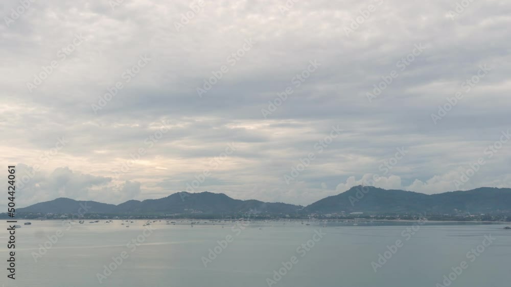 .time lapse cloudy sky above the mountain range..At Khao Khad viewpoint you can see around Ao Chalong gulf. .Phuket big Buddha on the mountain backgroud.. .time lapse cloudy sky above the mountain range..At Khao Khad viewpoint you can see around Ao Chalong gulf. .Phuket big Buddha on the mountain backgroud..