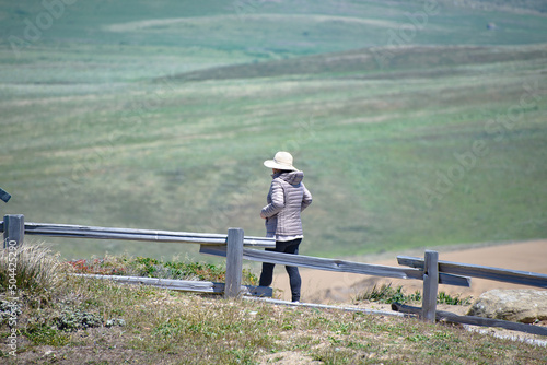 Woman walking in solitude on a scenic overlook