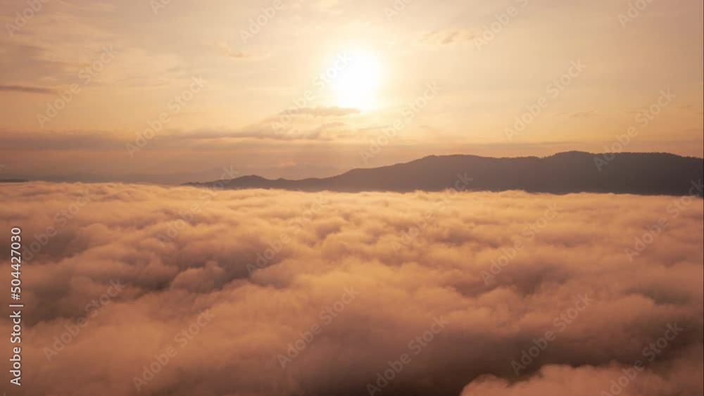 Hyper lapse Drone flight over the clouds during sunrise. Golden hour and amazing sun rays, beautiful cloudscape. Picturesque time lapse of white fluffy clouds moving softly on cloudy, misty weather. Hyper lapse Drone flight over the clouds during sunrise. Golden hour and amazing sun rays, beautiful cloudscape. Picturesque time lapse of white fluffy clouds moving softly on cloudy, misty weather.